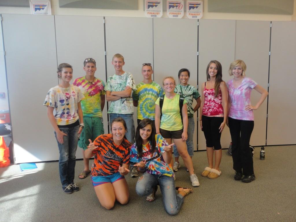 (From left to right, top row) Sophomore Abby Curran, Seniors Caleb Bay, TJ Soulier, Junior Joey Ternes, Seniors Katy Morrison, Jordan Pyle, Zoe Koppenhofer, Laurel Beaty, (bottom row) Annie Layden, and Caitlin Ritz of the band leadership team show off their tie-die for Tuesday Tie-Die Day.