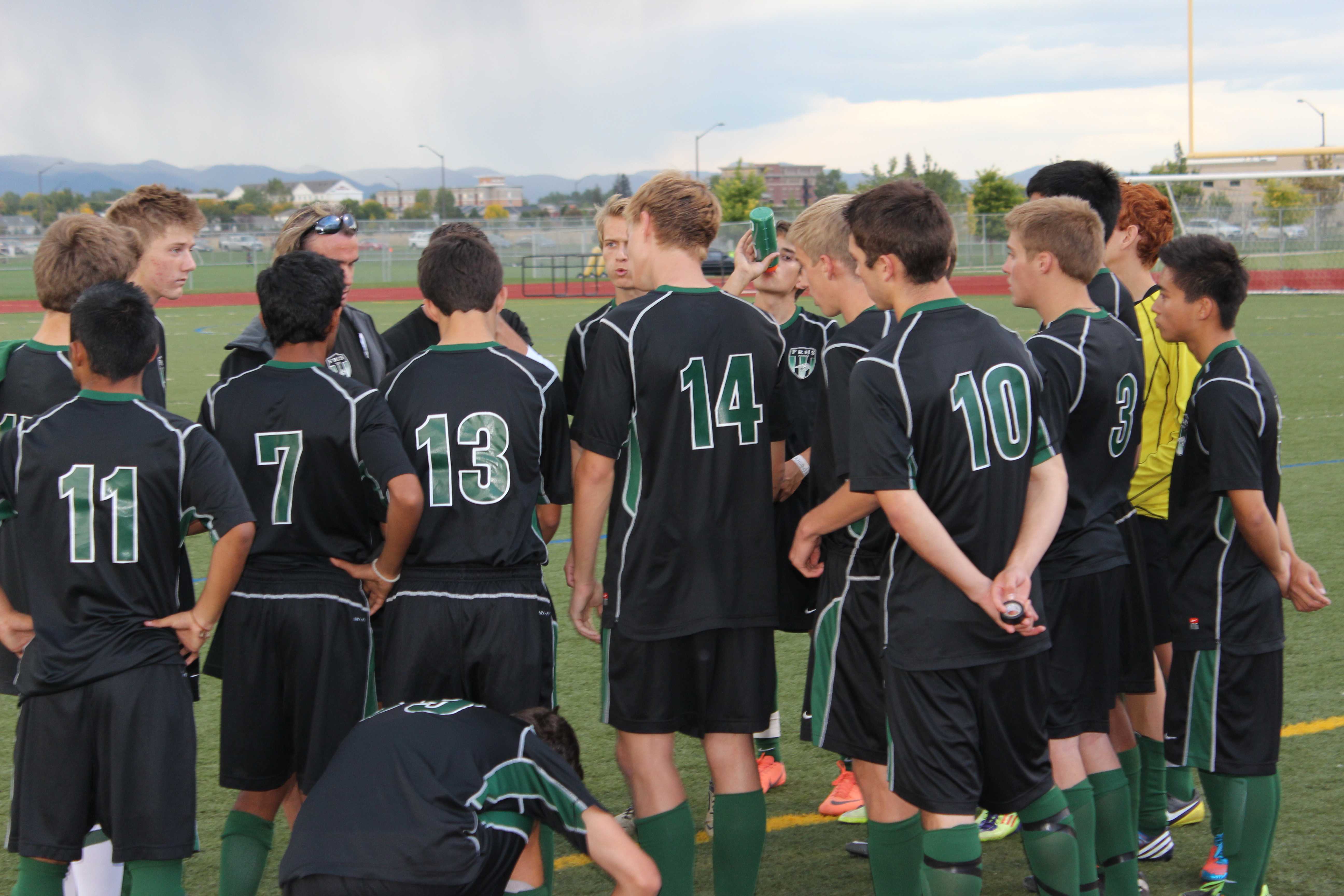 Team gathering together at halftime. 
Photo credit: Dylan Cox