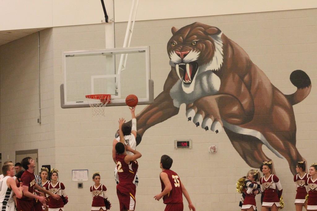 Senior Cody McCoy going up for a lay up against RMHS. Photo Credit: Amber Baack