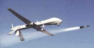 An unmanned Predator drone, firing a Hellfire missile. Increased drone attacks under the Obama administration have resulted in over 800 civilian casualties, 176 of whom were children. Photo credit: Wikimedia Commons. 