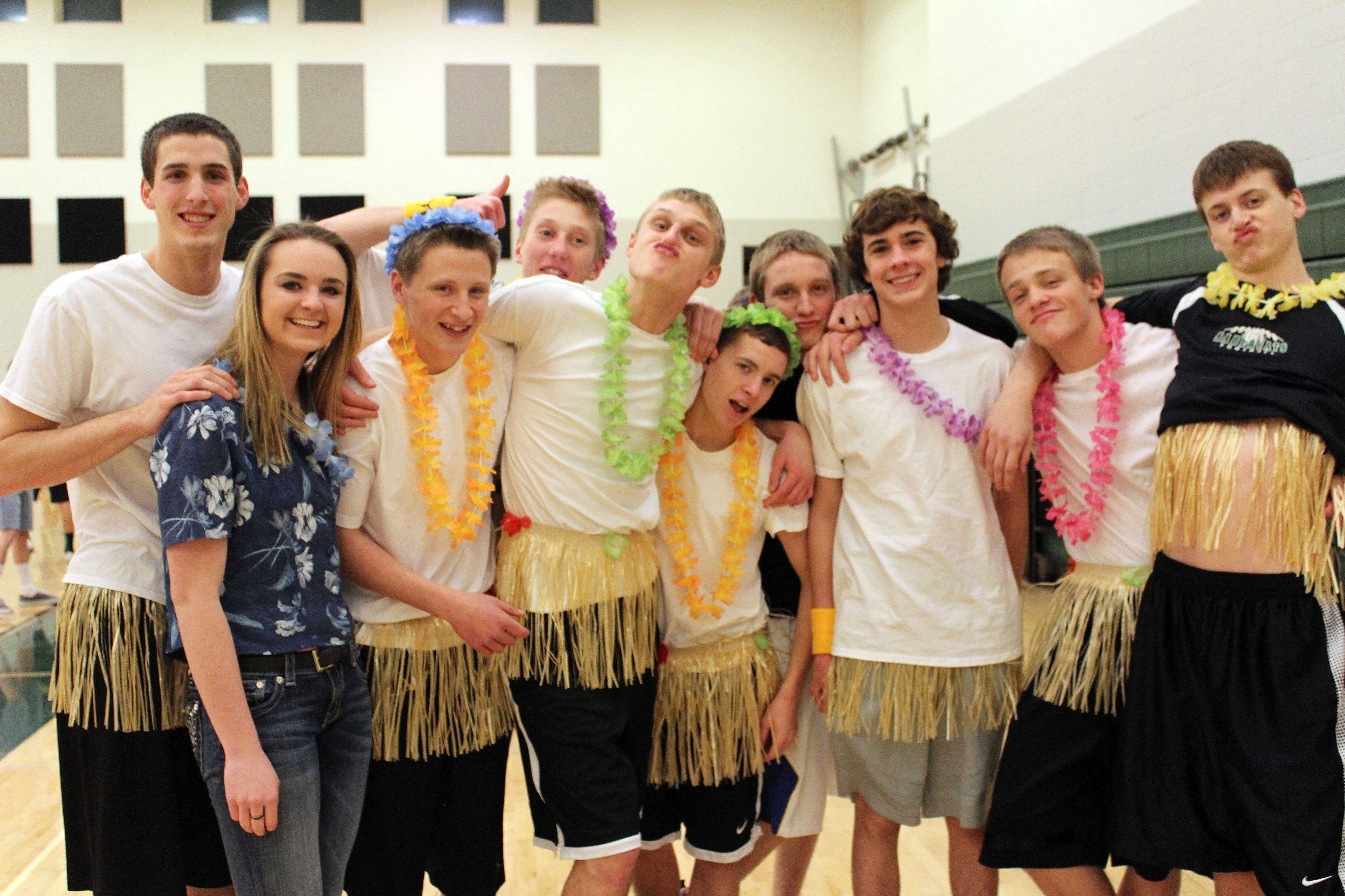 A team of juniors show off their hawaiian team spirit