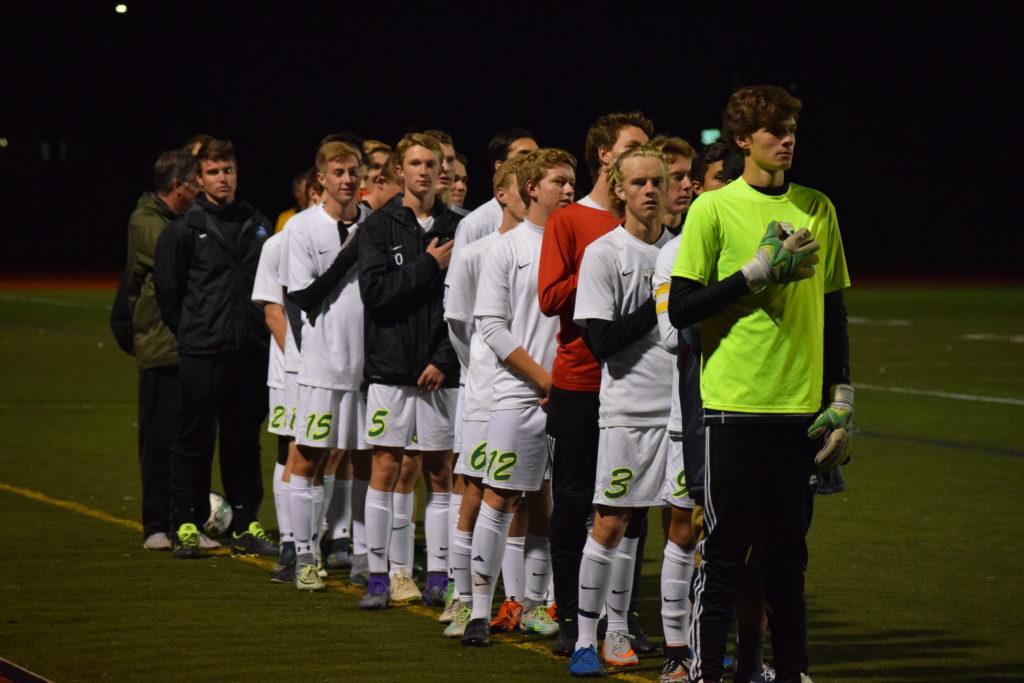 Boys varsity soccer stands for the national anthem on senior night. Photo Credit: Haley Rockwell