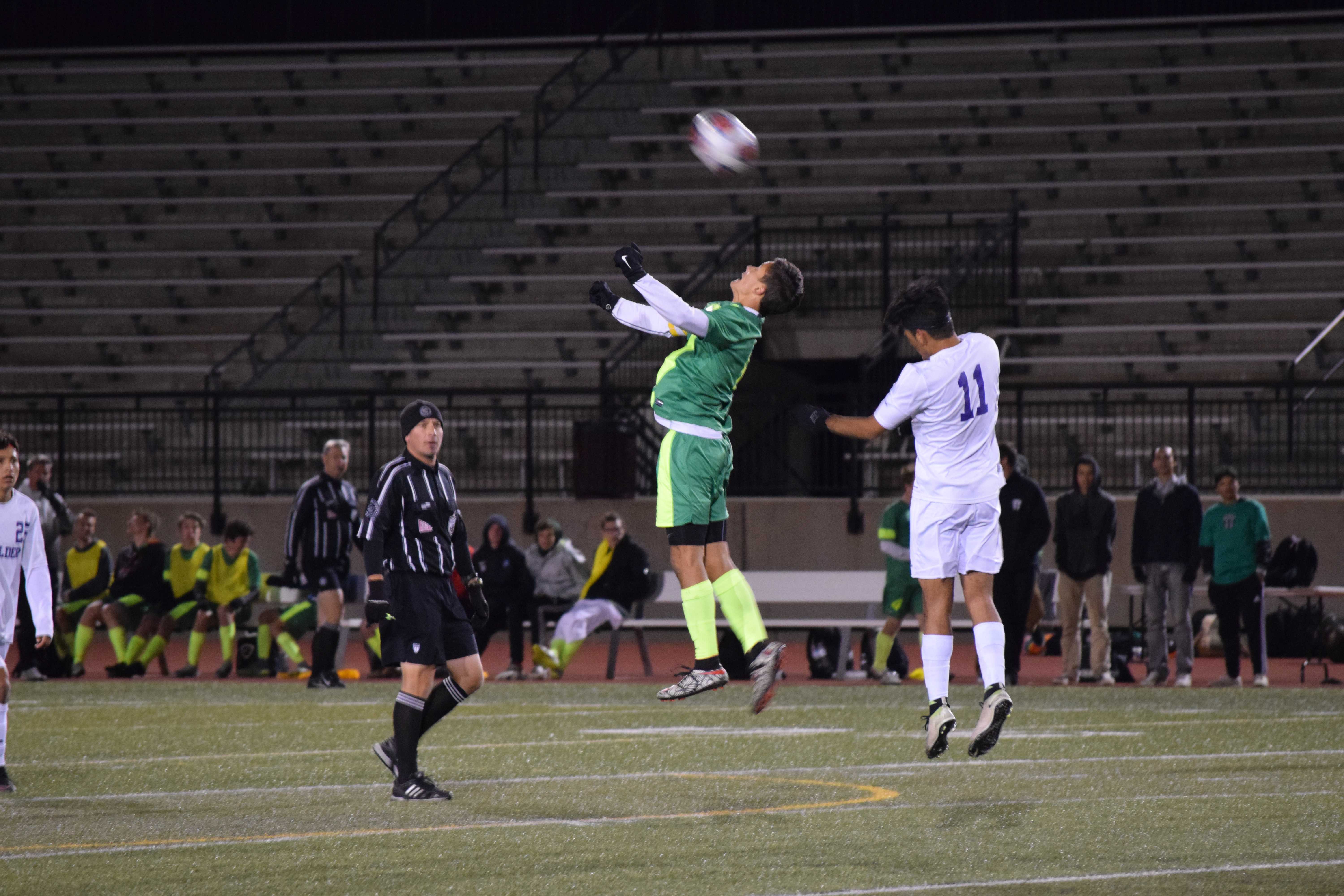 Martinez goes up to flick the ball over Boulder defense to Durand making a run. Photo Credit: Haley Rockwell