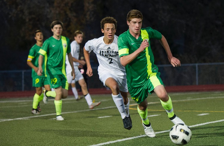 Hause dribbles up the field in the last minutes of the game. Photo Credit: Daniel Brenner