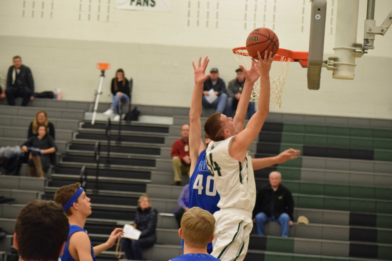 Colby Pipher beats a Broomfield defender and goes up for a layup, Tuesday, January 24. Photo Credit: Haley Rockwell. 