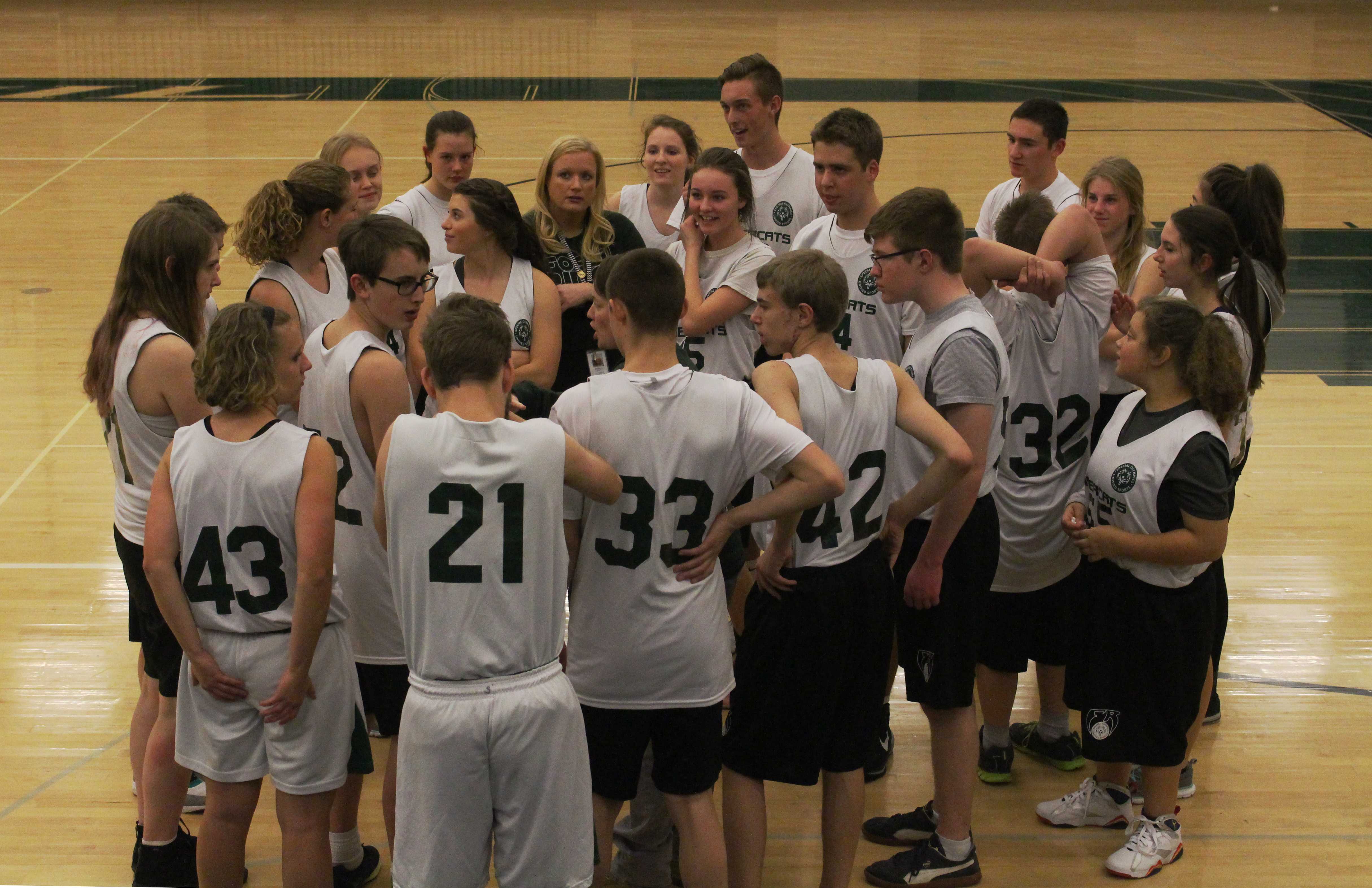 The team gathers for a Sabercat chat. Photo Credit: Karen Manley