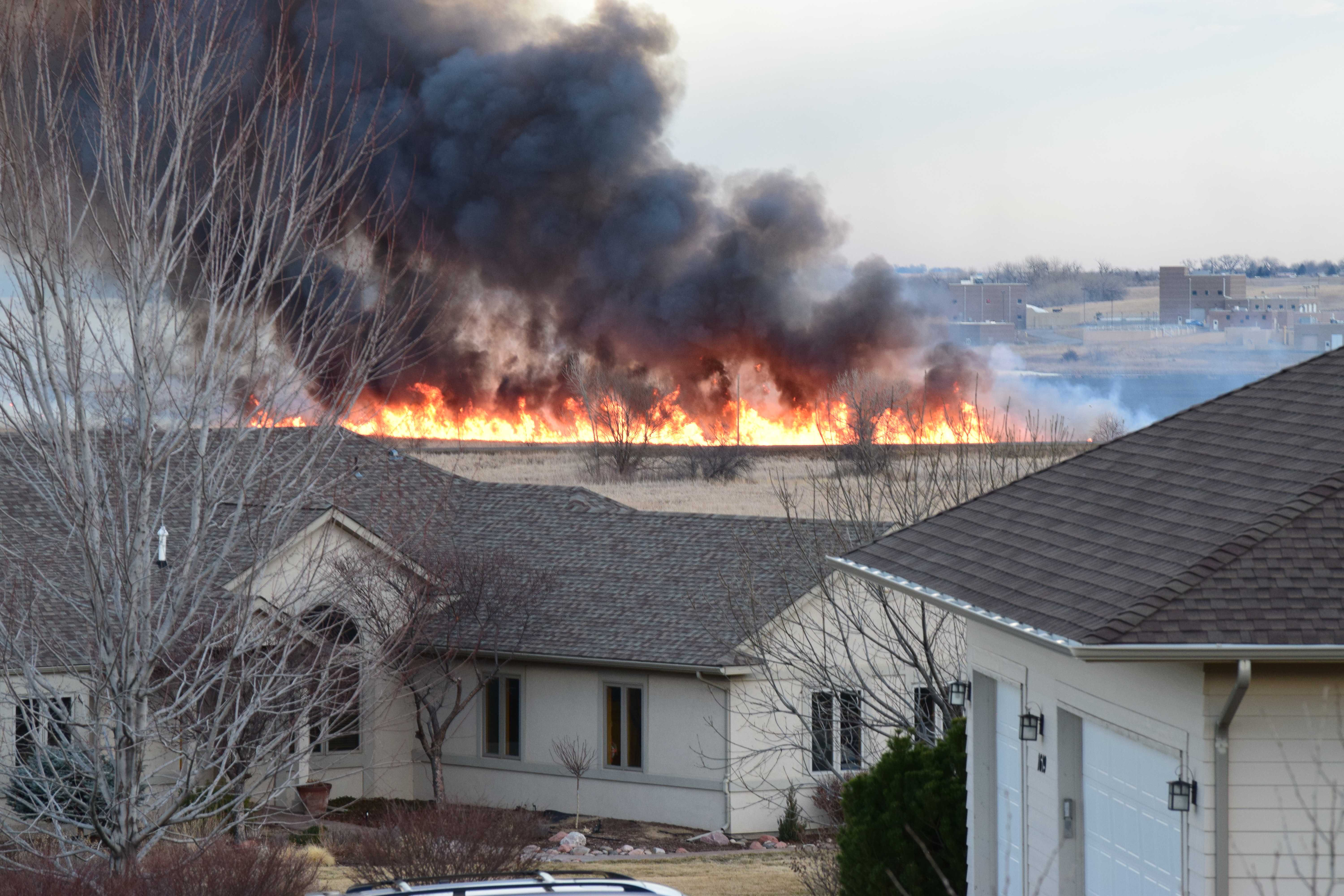 Breaking News: Firefighters battle grass fire in Fort Collins