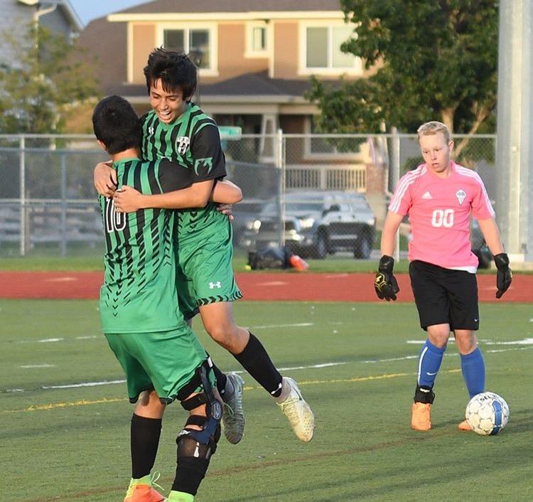 The Carlton brothers celebrate their goal that put the Sabercats ahead of the Impalas 2-0. Photo Credit: Mrs. Carlton
