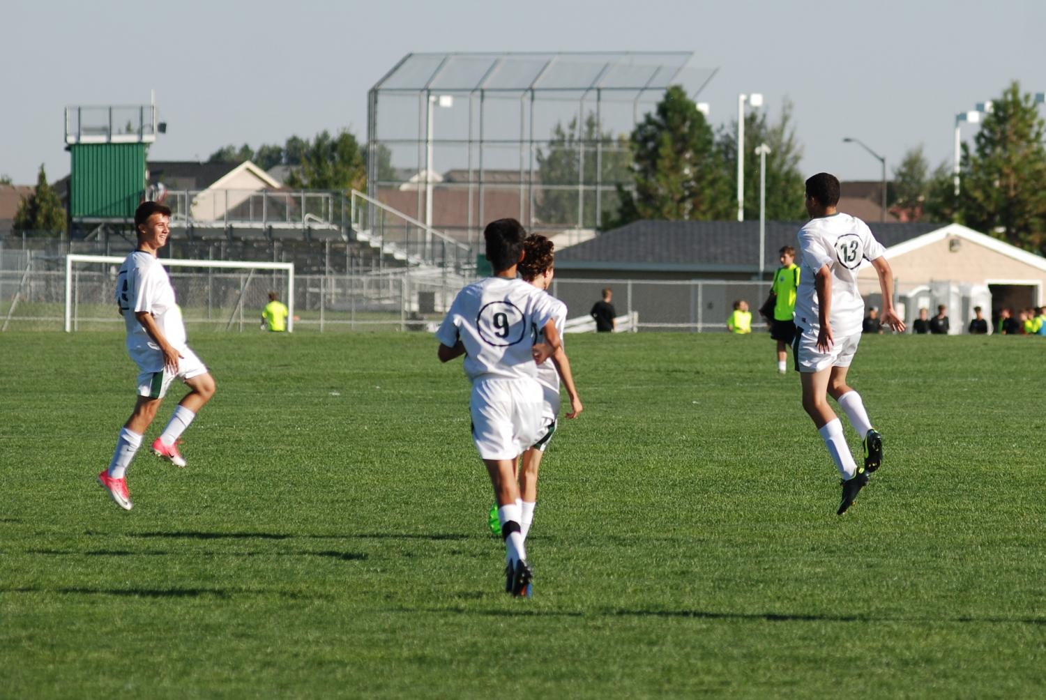 #13 Guilherme Ribas and his team celebrate his goal, which tied them up with Rocky Mountain and rejuvenated them.