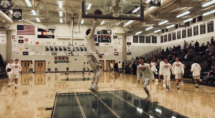 Brandon Lambrecht goes up for a layup during warmup prior to league game vs Greeley West. Photo Credit: Emily Brey