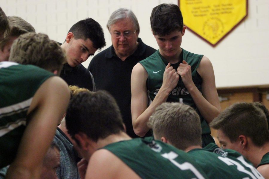 Fossil Ridge huddles together after Coach Johannsen calls a timeout. Photo Credit: Emily Brey