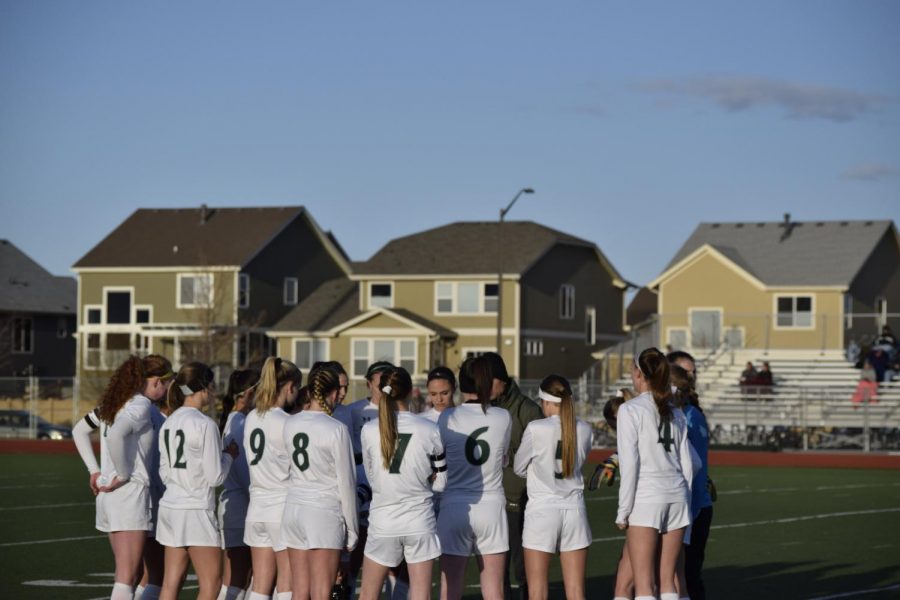 Girls in a huddle before taking the field Photo Credit: Olivia Doro