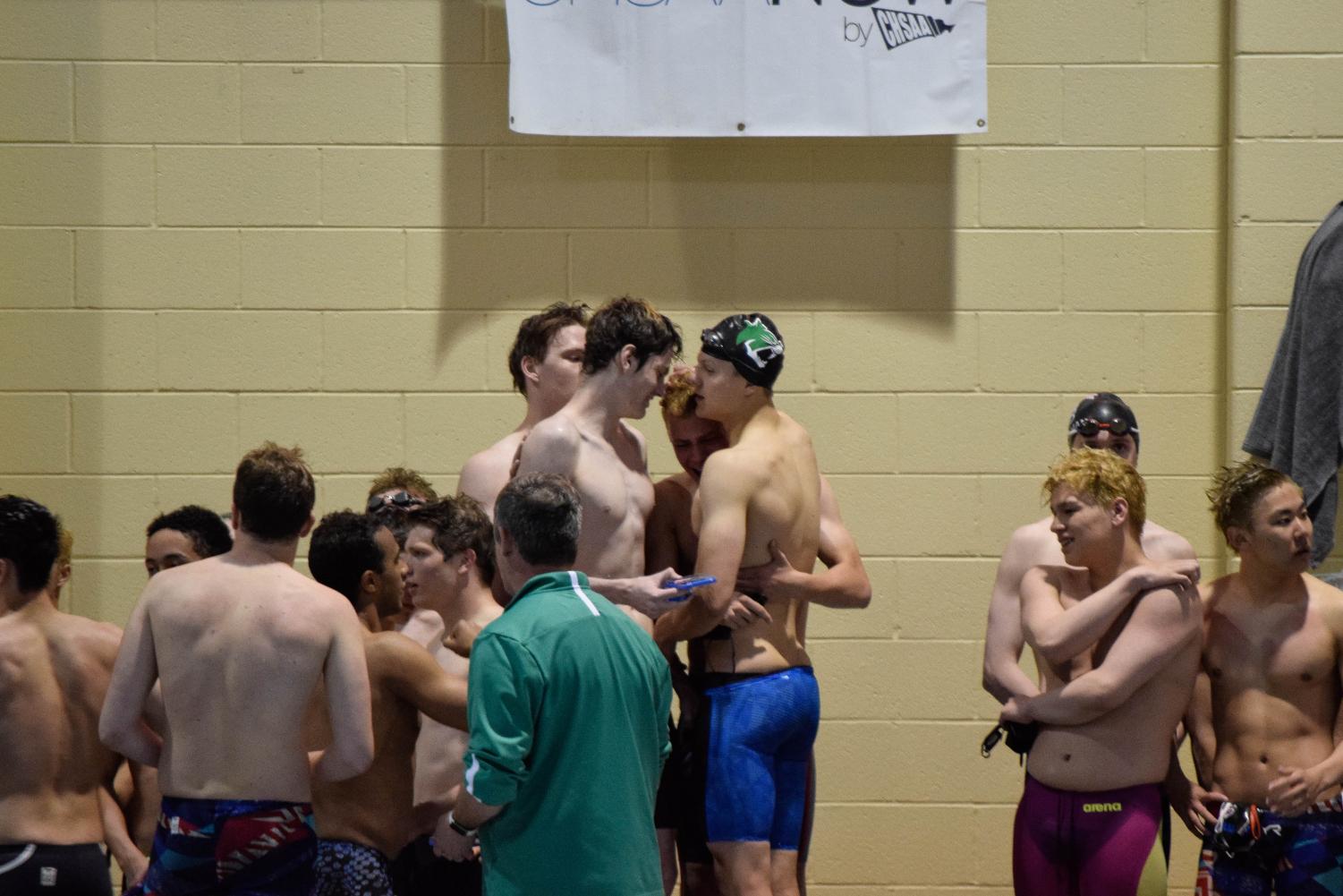 Senior Danny Kovac comforts fellow senior Lars Worlund along with Richard Dauksher and Matt Geraghty. Photo Credit: Olivia Doro