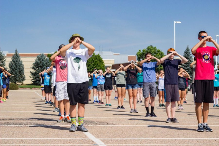 Band+students+rehearse+marching+in+the+staff+parking+lot.