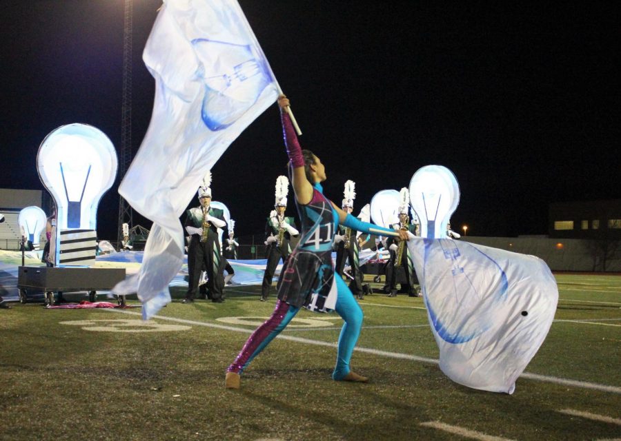 Senior Sienna Morgan is a four year member of Color Guard, pictured here performing in her final high school field show.