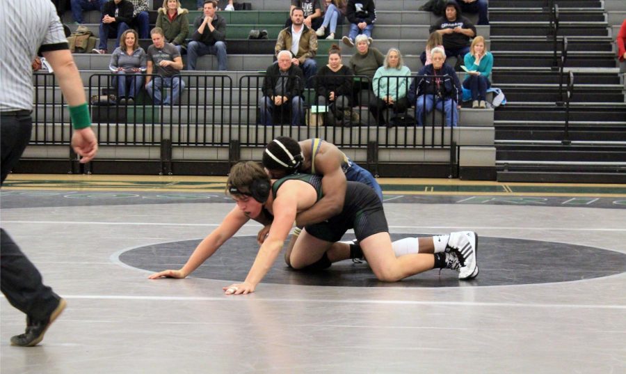 Parker begins the second period of his match by fighting for an escape. 