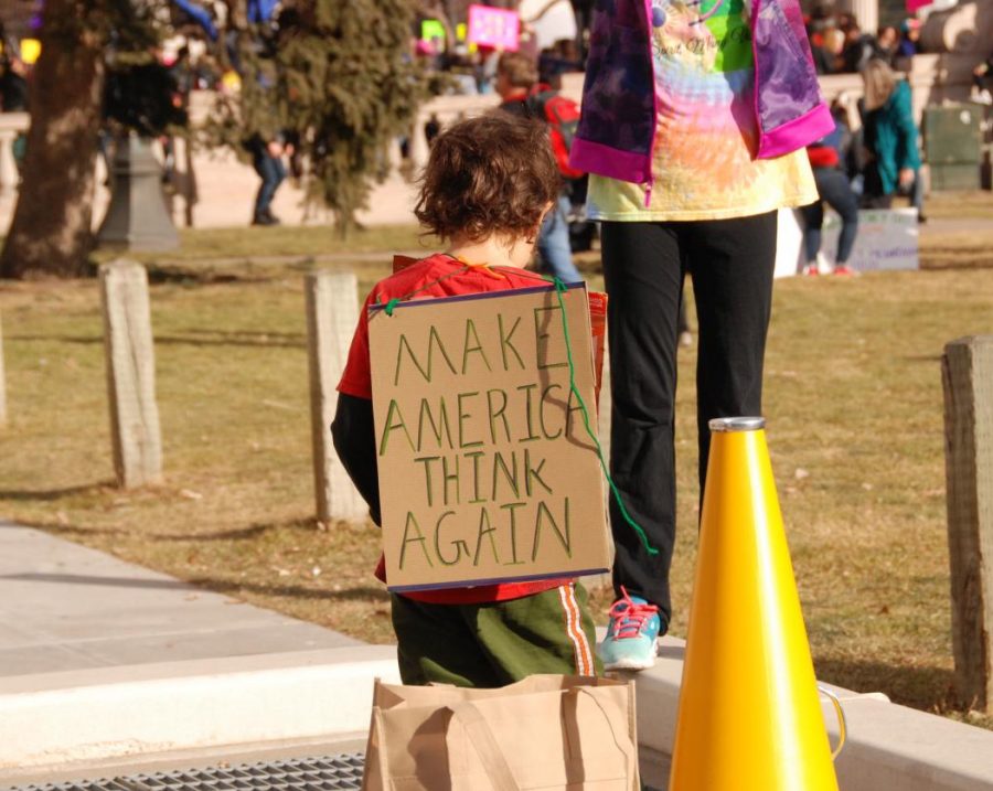 This young boy wore a message to America on his back at the Womens March on Denver in January of 2018. It rings true today.