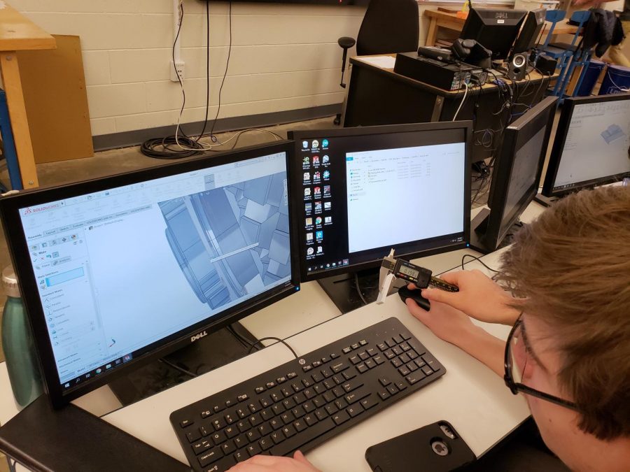 Students use Solidworks to make a virtual model of the robot 