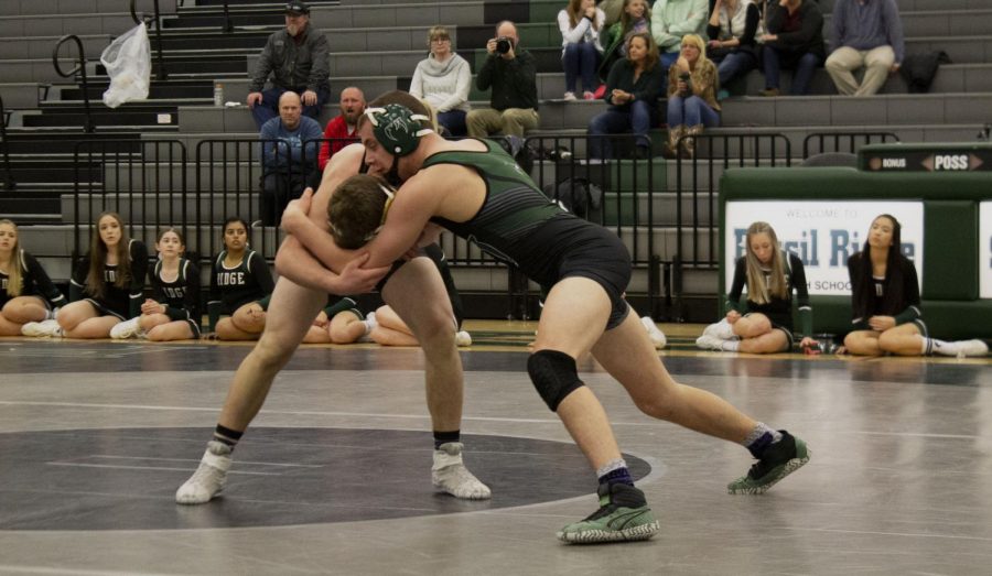 Cody Ginther grapples with his oponent