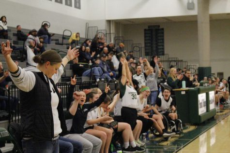The team celebrates a game-changing point. The team scored with forty seconds left, breaking the longstanding tie.