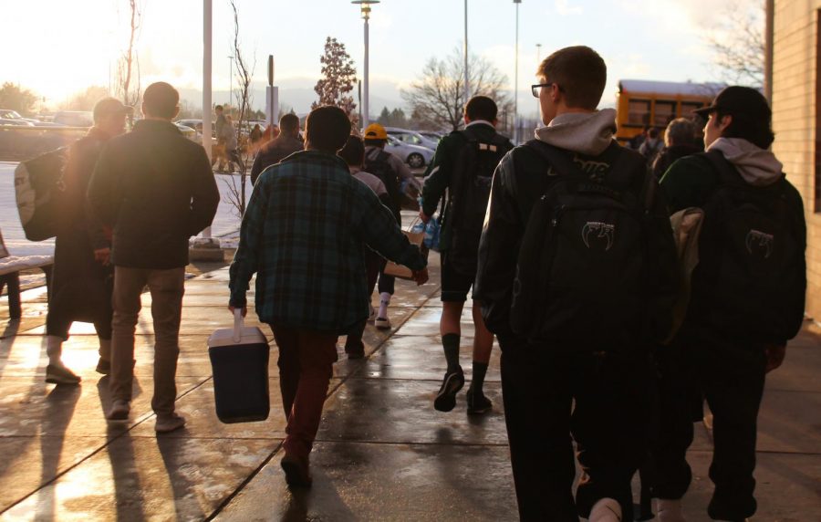 The Fossil Ridge wrestling team leaves Legacy High School after the tournament concluded. 