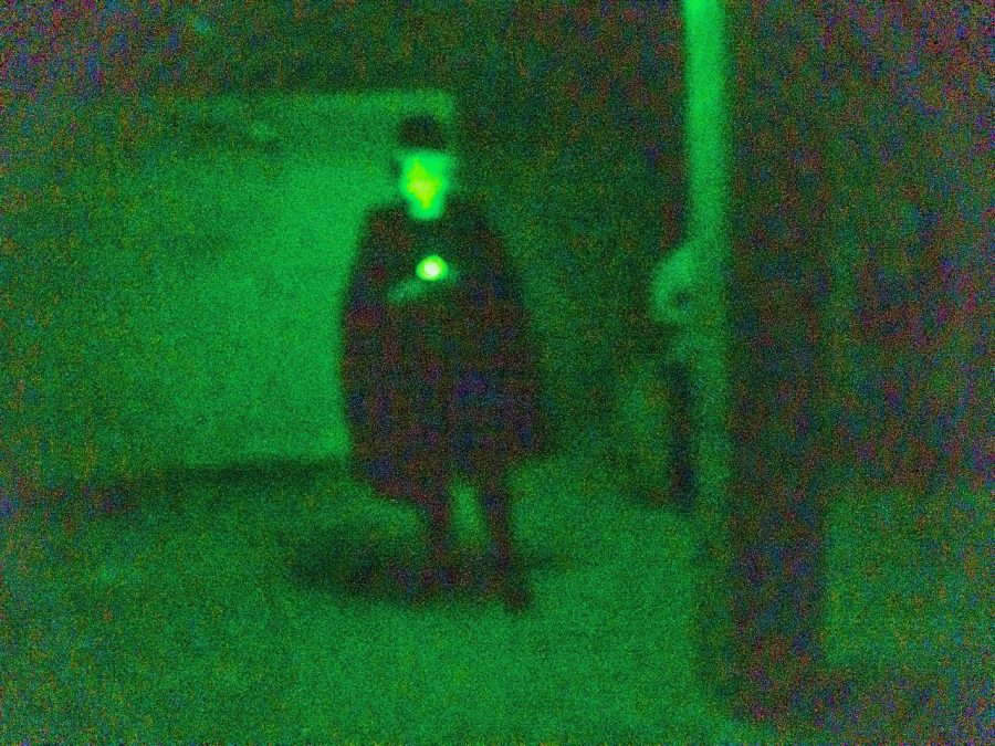 A+ghost+tour+guide+illustrates+a+dark+tale.