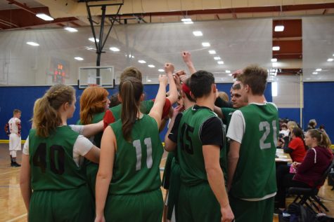 As the first game begins, the starters bring it in for a cheer: "1, 2, 3, FOSSIl!"