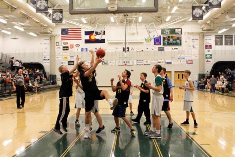 Both teams worked extraordinarily hard to put points on the board. The score, 6-6, can be seen in the background as this Rocky player attempts to break the tie. 