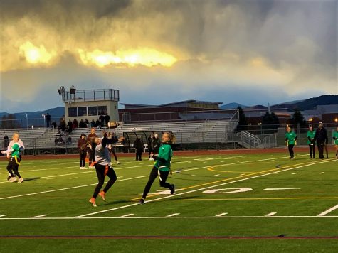 Teams of each grade level compete in a game of flag football.