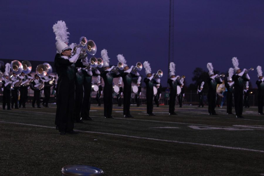 The brass feature amazes the crowd as the marching band  performs their halftime show.