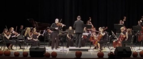Guest violinist Michael Davis performs with Fossil Ridge orchestra.