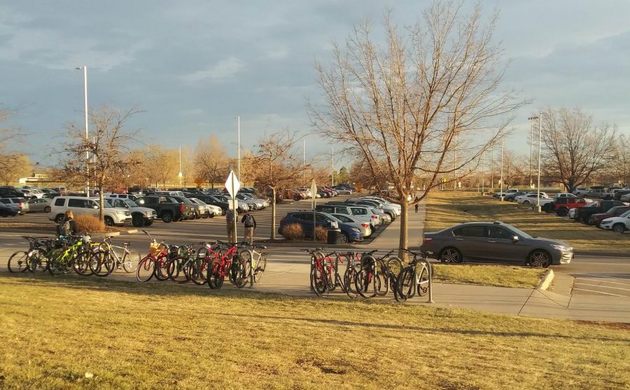 Students cars sit parked in the east parking lot at Fossil Ridge High School. 