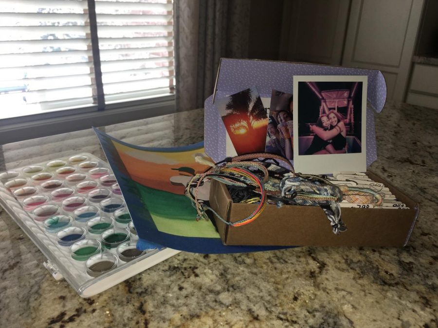This photo shows  my embroidery thread and a few bracelets as well as my watercolor paint and a piece I am currently working on.