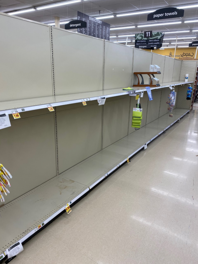 King Soopers shelves as of 4/8/20. The last roll of paper towels can be seen at the far end.