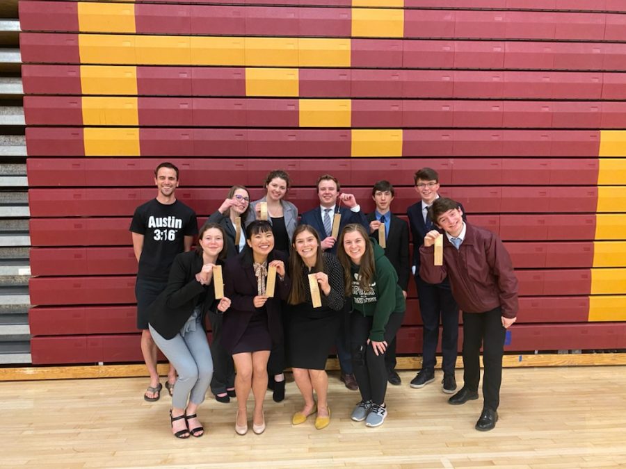The Fossil debate team celebrates completing a tournament last year, which outcomes qualified them for State.