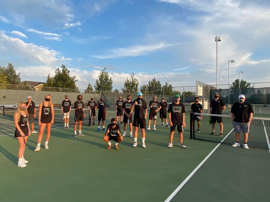 Fossil Ridge Tennis team and coaches socially distance for team photo