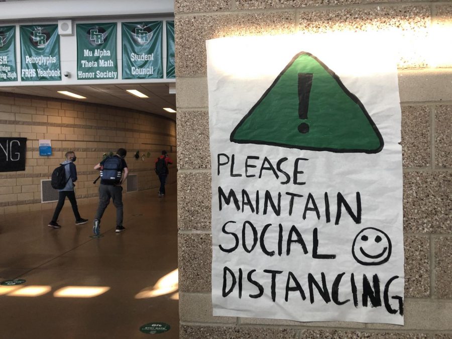 Fossil emphasizes social distancing with signs throughout the halls.