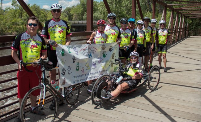 Bikers from the 2020 freedom tour, along with Rich Dixon (front) pose during a break in their ride. This group biked over 200 miles in four days.
