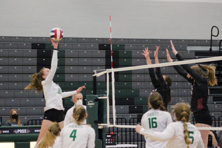 Melanie Smith is going up for a spike.