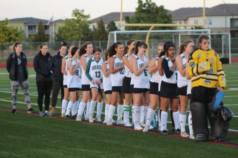 The Fossil field hockey team lined up for the national anthem before their game against Smoky Hill