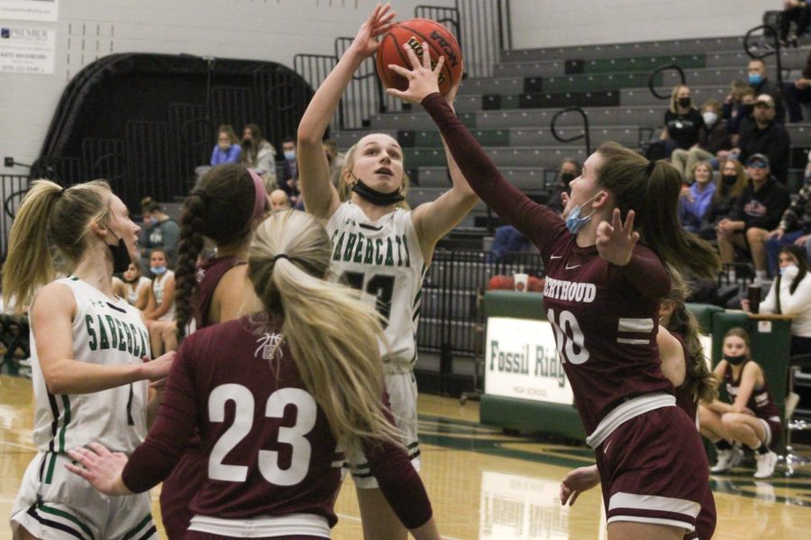 Freshman Gianna Leone going up for a contested layup against several Berthoud defenders
