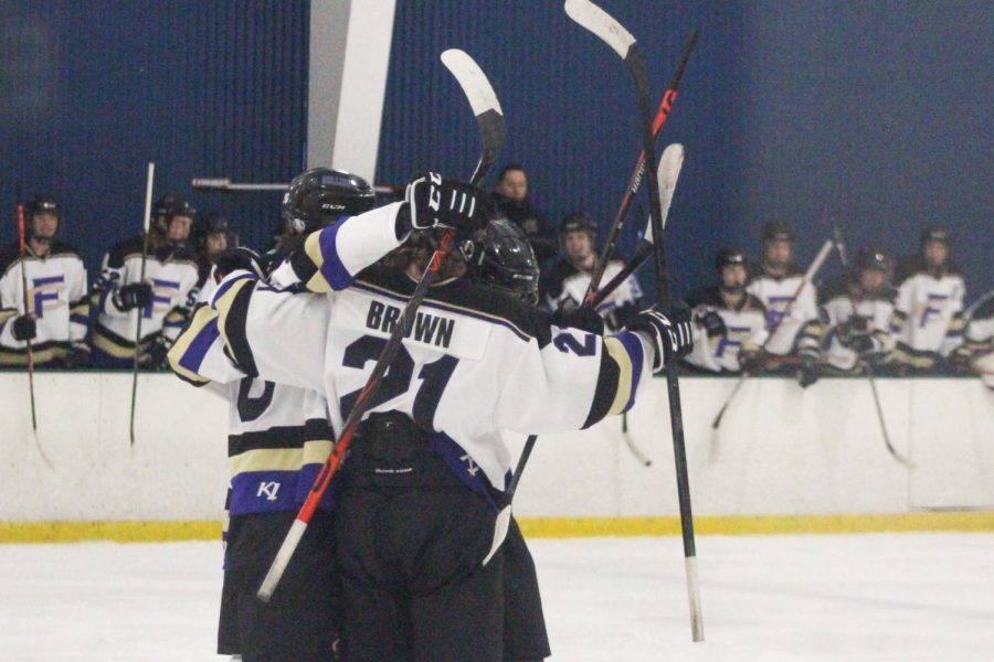 Collins players celebrating after a goal