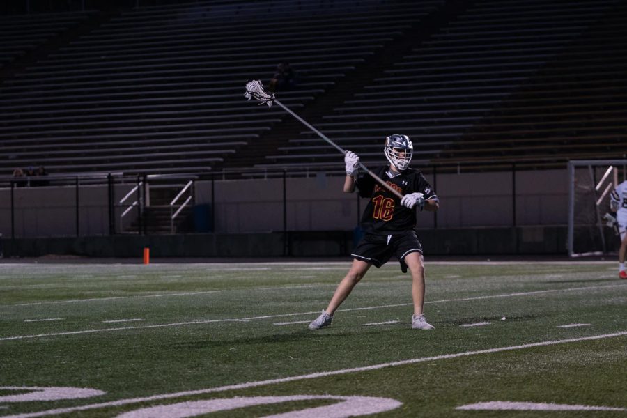 Brady Hintz, district lacrosse player from Fossil pictured defending during their game against Boulders lacrosse team.