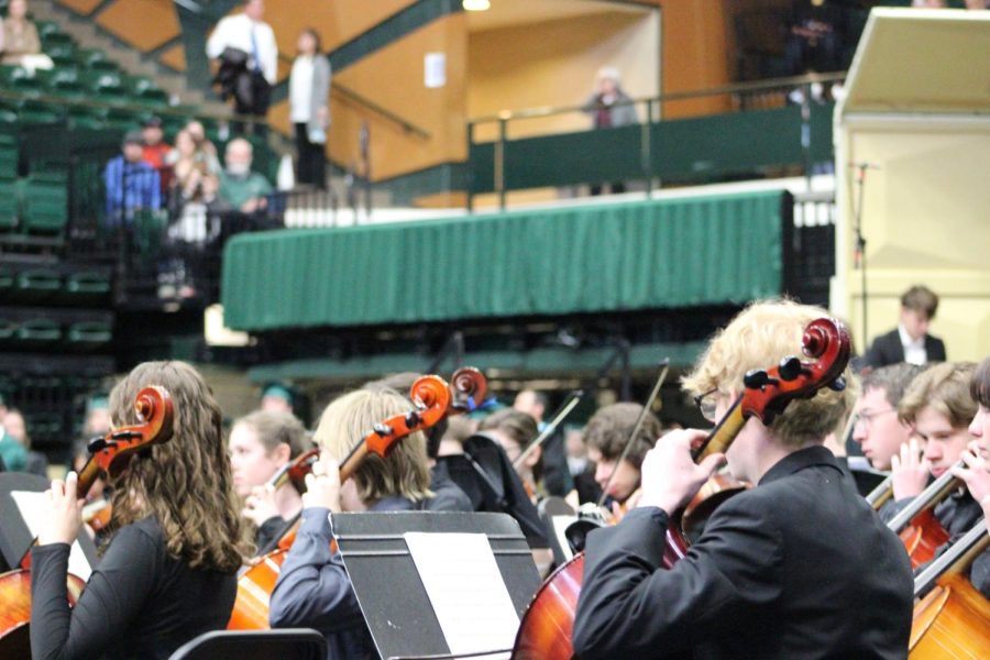 Members of the Fossil Ridge band and orchestra perform Pomp and Circumstance.