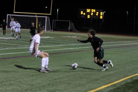 Scelfo dribbling the ball during Fossil's match against Fort Collins.