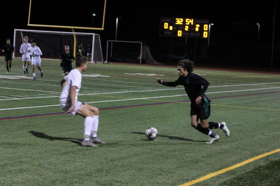 Scelfo dribbling the ball during Fossils match against Fort Collins.