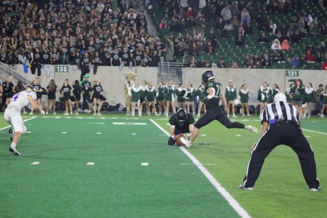 Fossil kicker Bryce Olson kicking an extra point against Fort Collins.