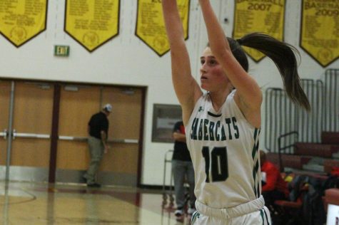 Ella Lavigne hoisting up a three in a game early in the season against Rangeview.