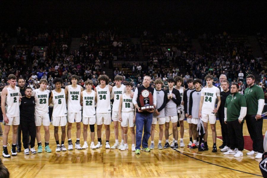 Fossil Ridge holding their runner-up trophy after losing the 2023 6A title game.
