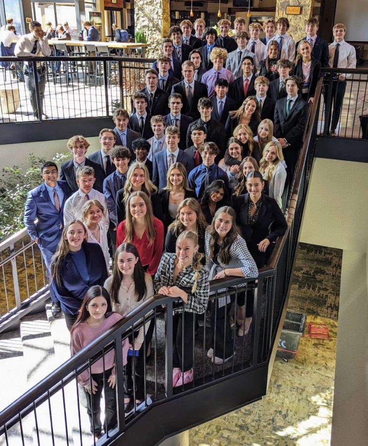 DECA+participants+pose+for+a+team+picture+together+at+their+state+competition.